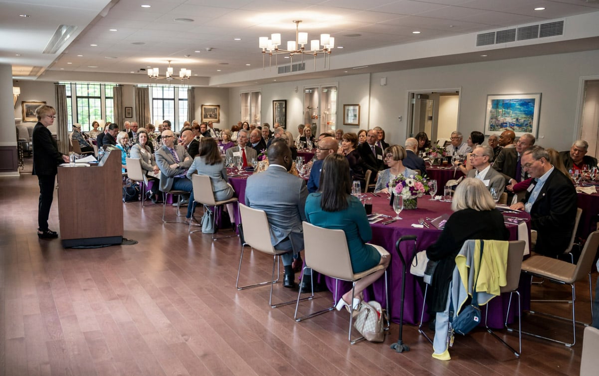 People seated around tables at the Rogers Society Luncheon