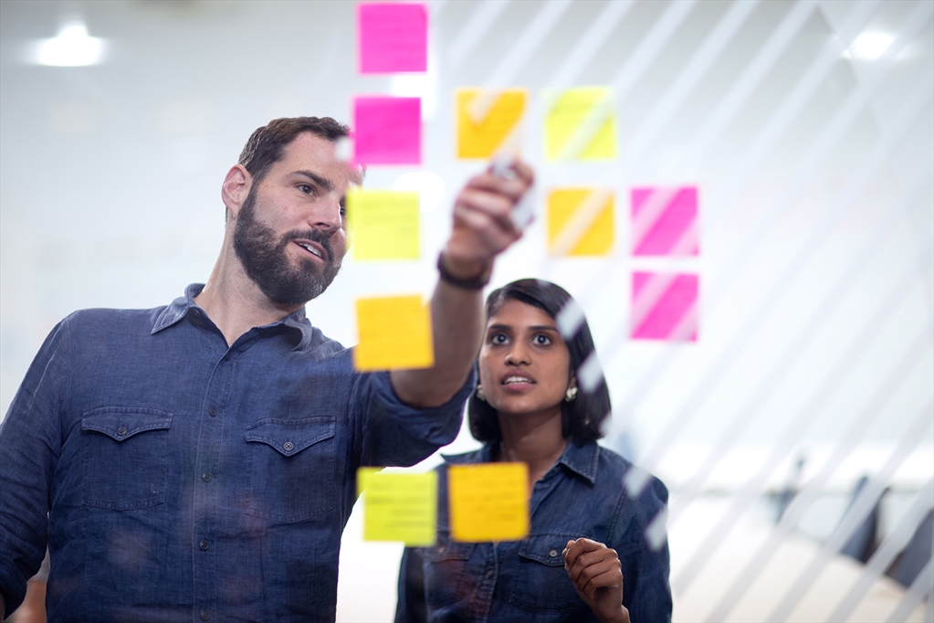 David Schonthal looking at notes with colleague