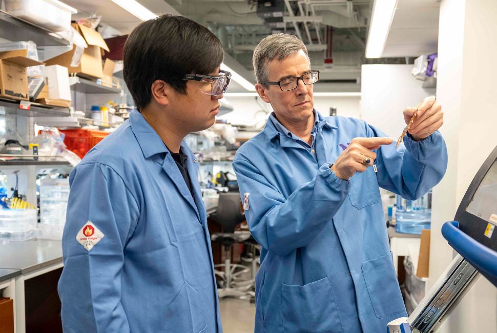 John Rogers in a lab working with another scientist