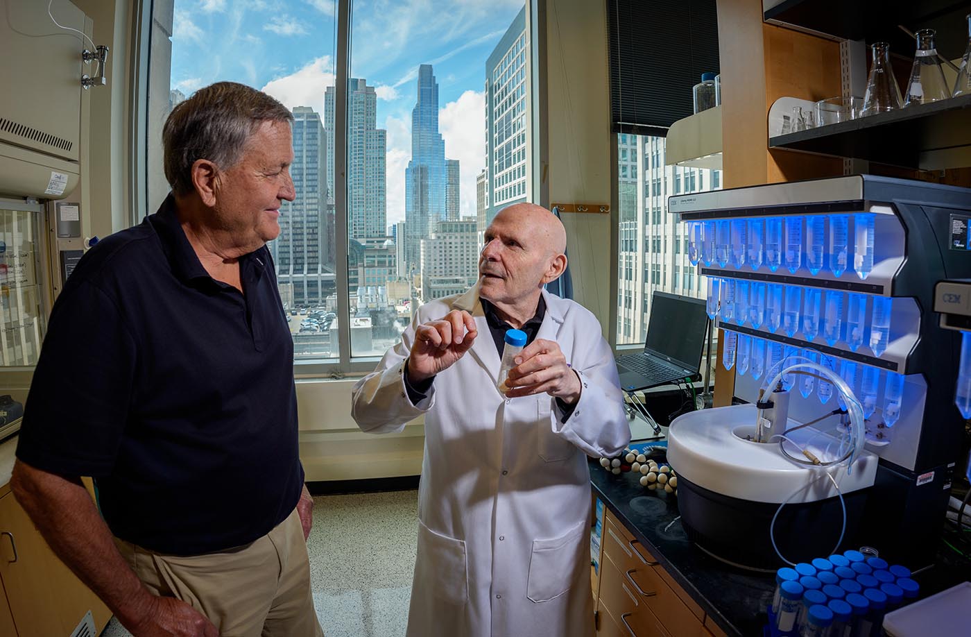 John Potocsnak, left, and Samuel Stupp in the laboratory where the molecules are made for the spinal cord injury therapy.